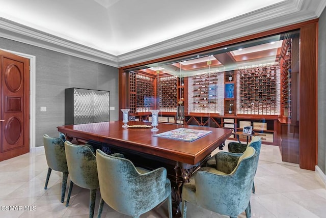 wine room featuring crown molding and light tile patterned flooring