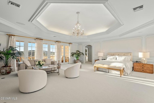 bedroom with ornamental molding, a raised ceiling, and carpet floors