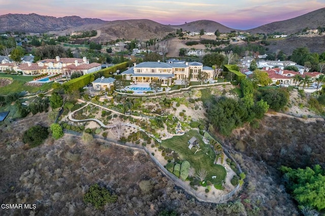 aerial view at dusk with a mountain view