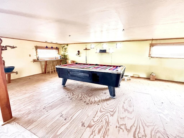 game room with light hardwood / wood-style floors