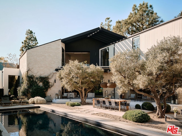 rear view of house featuring a patio area