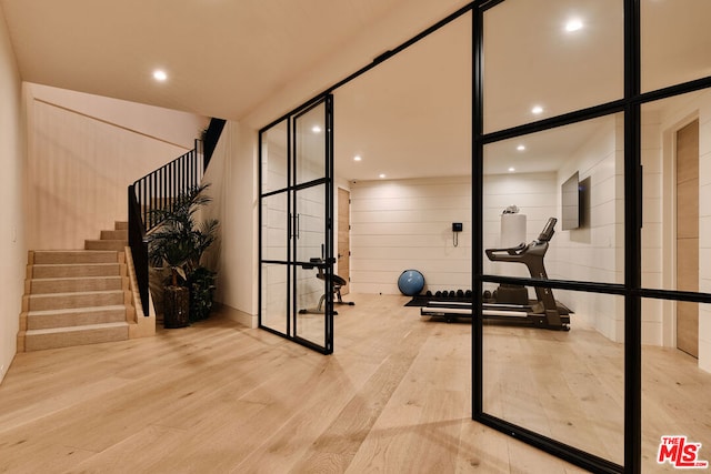 workout room with light wood-type flooring