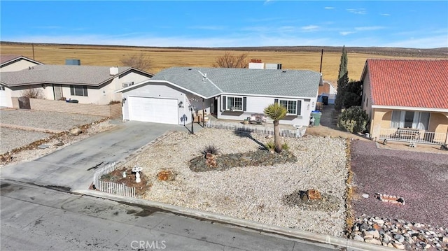 ranch-style home featuring a garage