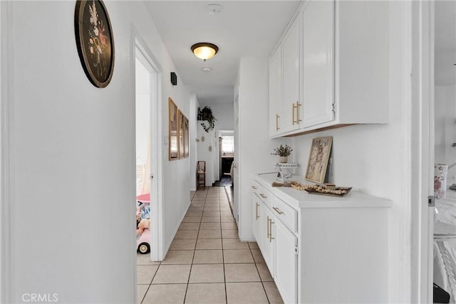 hallway featuring light tile patterned floors