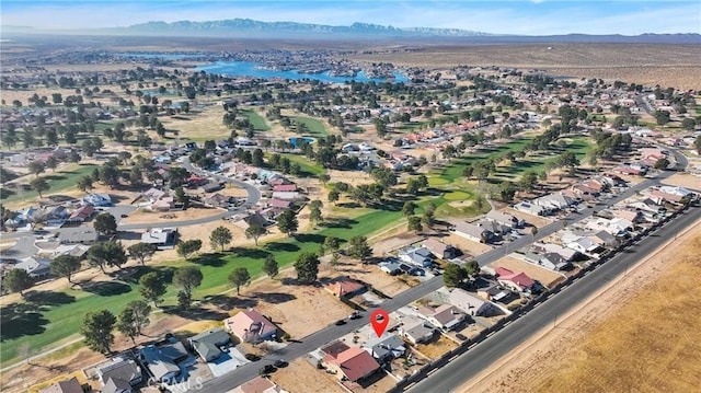 aerial view featuring a water and mountain view