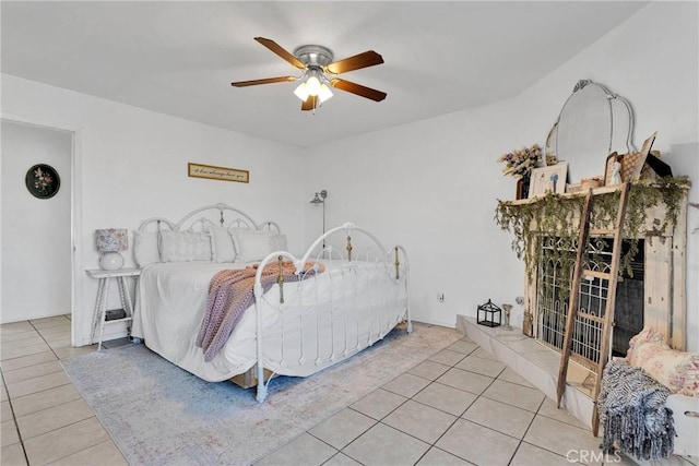 bedroom with light tile patterned floors and ceiling fan