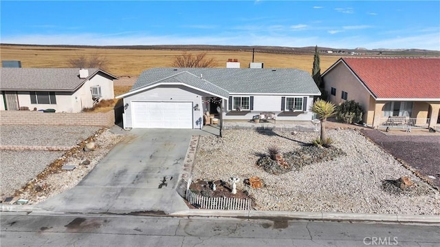 ranch-style home featuring a garage