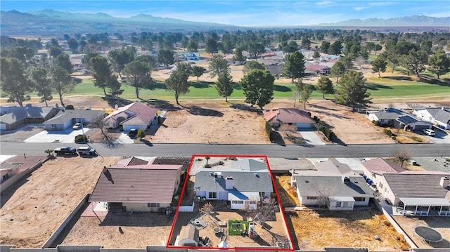 birds eye view of property featuring a mountain view