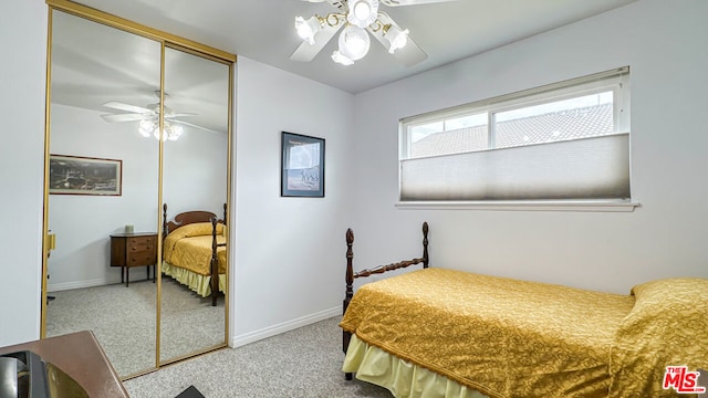 bedroom with carpet, ceiling fan, and a closet