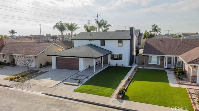 view of front of house featuring stucco siding, concrete driveway, a garage, a residential view, and a front lawn