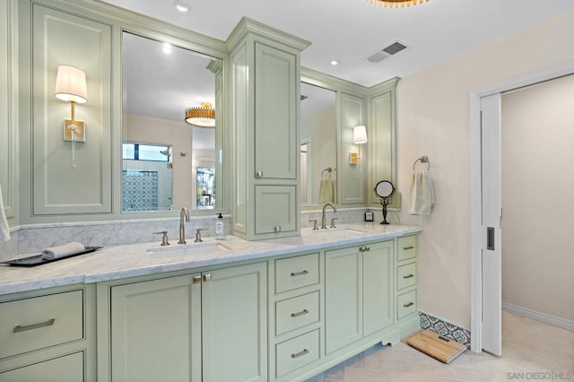 bathroom featuring tile patterned flooring and vanity