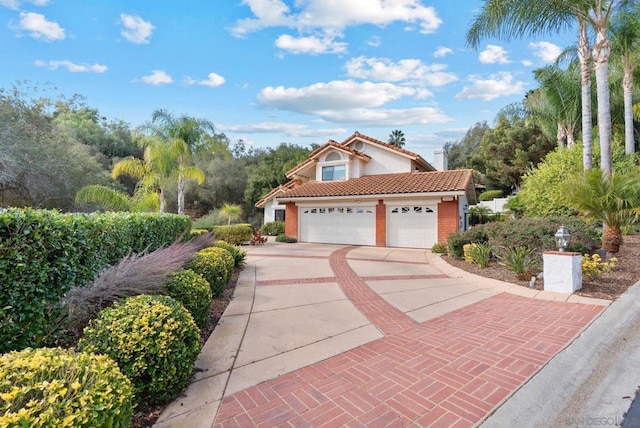 mediterranean / spanish-style home featuring a garage