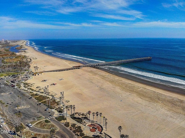 aerial view featuring a water view and a beach view