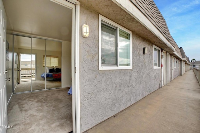 view of side of property featuring a patio area