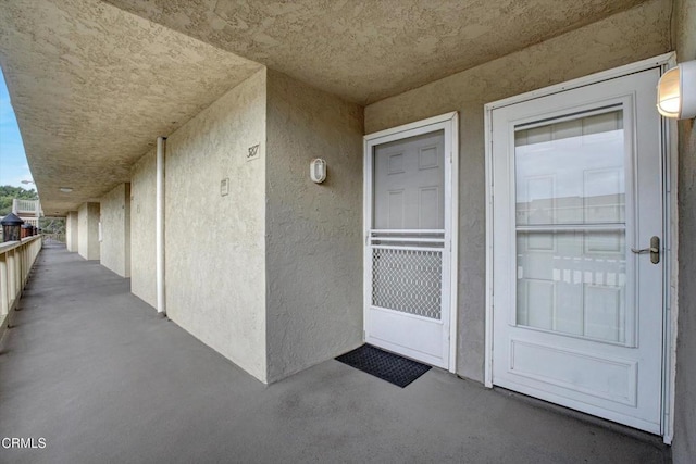 entrance to property featuring a balcony