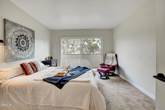 bedroom with carpet and access to exterior