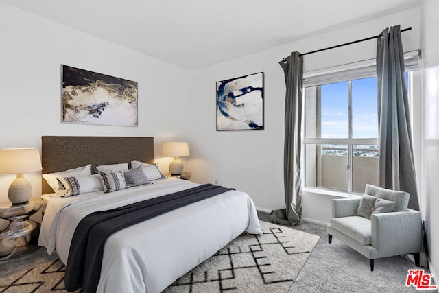 bedroom featuring light colored carpet