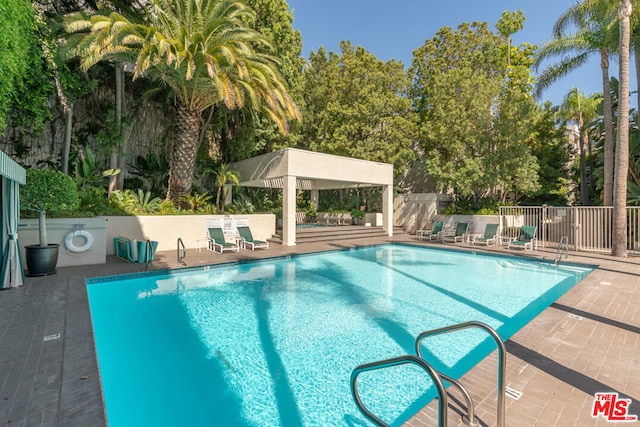 view of pool with a gazebo and a patio