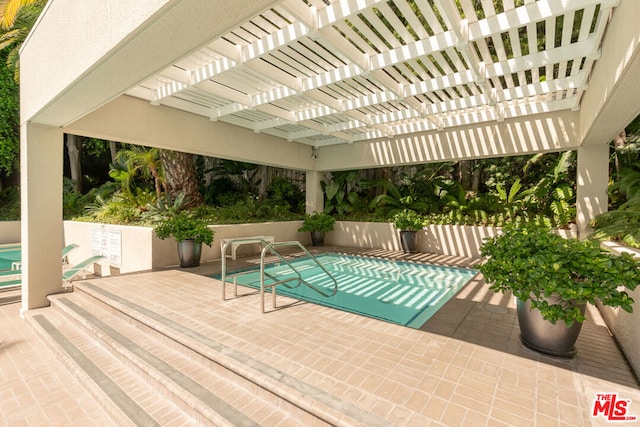 view of swimming pool featuring a pergola and a patio