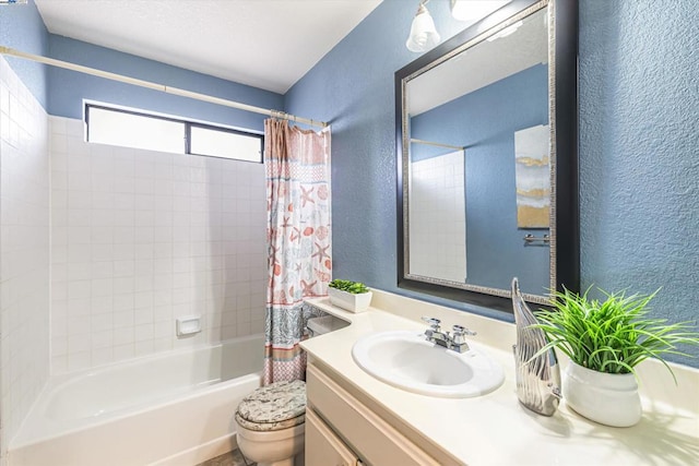 full bathroom featuring vanity, shower / bath combination with curtain, and toilet