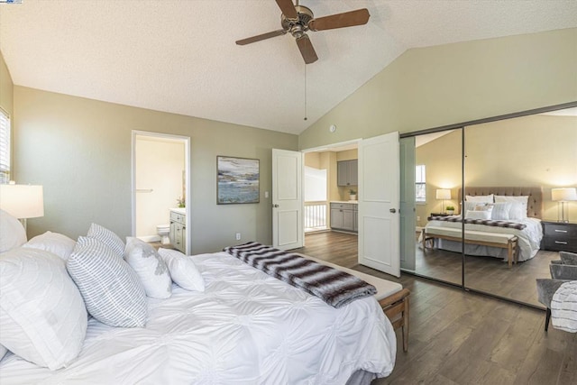 bedroom with ensuite bathroom, lofted ceiling, hardwood / wood-style flooring, ceiling fan, and a closet