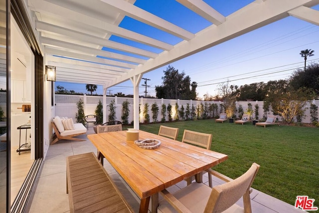 view of patio / terrace with a pergola and a fire pit