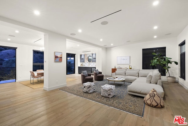 living room with light hardwood / wood-style flooring