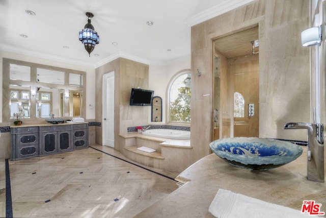 bathroom with ornamental molding, parquet flooring, vanity, and a bathtub