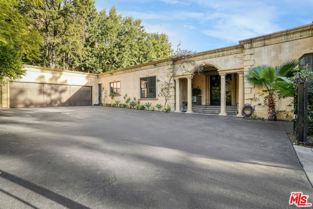 view of front of property featuring a garage