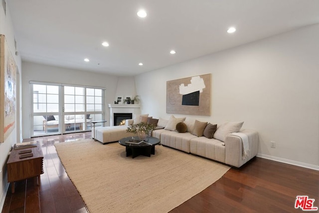 living room with dark hardwood / wood-style floors