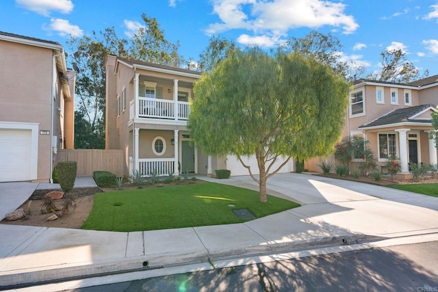 view of front of home featuring a porch, a garage, a balcony, and a front lawn