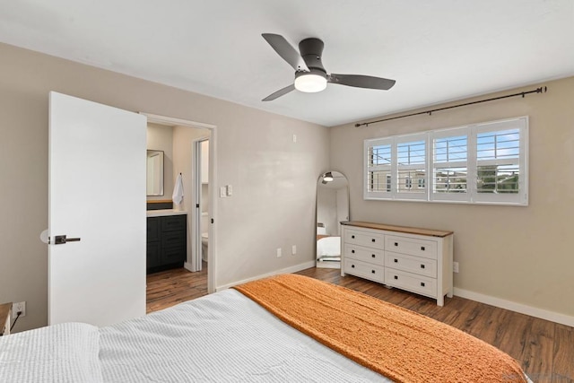 bedroom with hardwood / wood-style flooring, ensuite bath, and ceiling fan