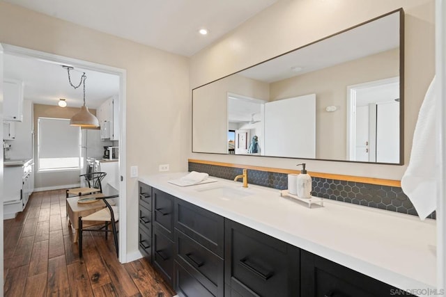 bathroom with vanity, hardwood / wood-style floors, and a shower with shower door