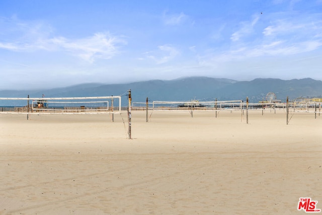 view of community featuring a view of the beach and a water and mountain view