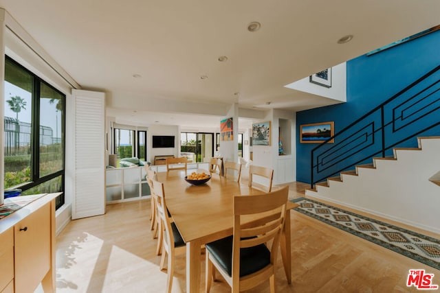 dining space featuring light wood-type flooring