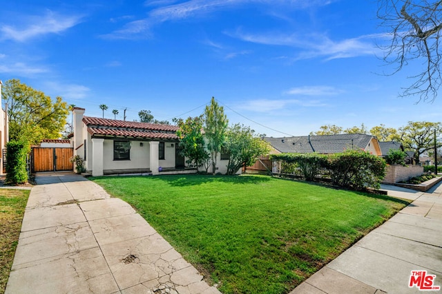 ranch-style house featuring a front lawn