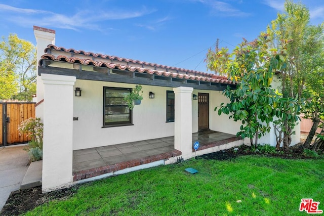 exterior space featuring a yard and a patio