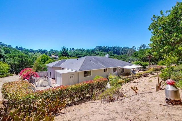 view of side of property with a patio area