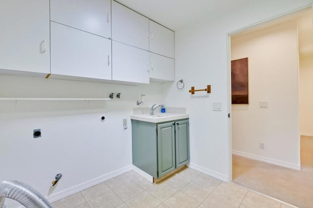 washroom featuring cabinets, gas dryer hookup, sink, and hookup for an electric dryer