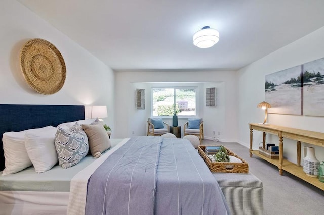 bedroom featuring light colored carpet