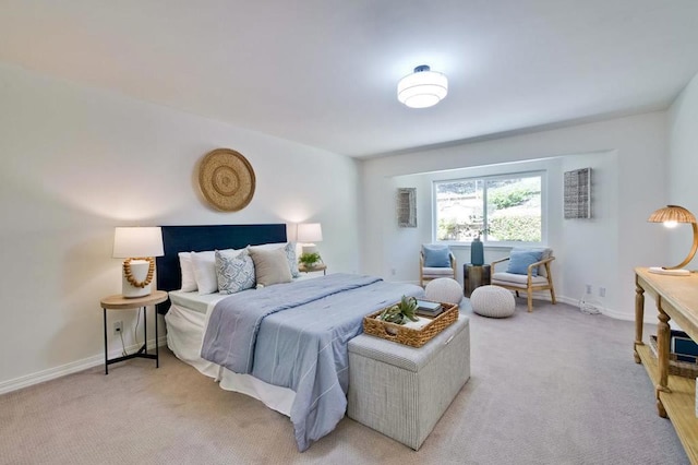 bedroom featuring light carpet