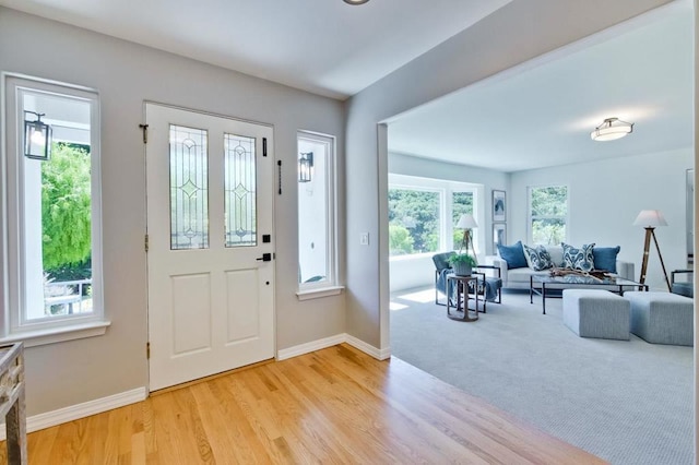 entryway with light hardwood / wood-style floors