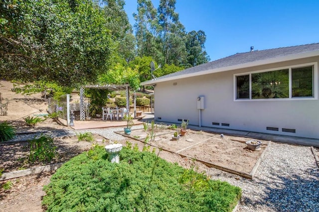 exterior space with a pergola and a patio