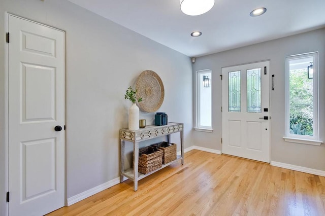 entrance foyer featuring hardwood / wood-style floors and a wealth of natural light