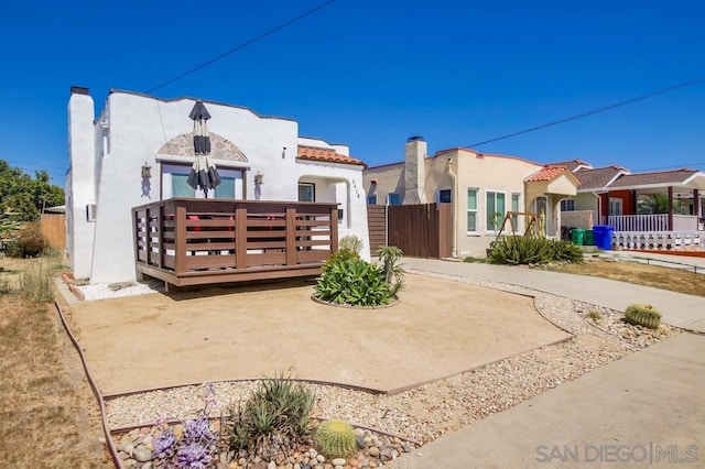 view of front of property featuring a wooden deck