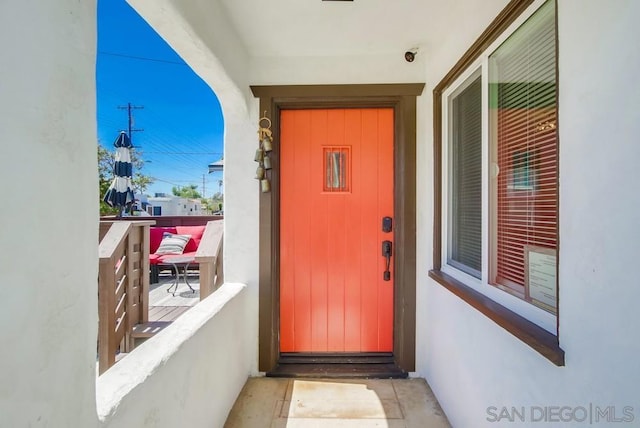 entrance to property with a balcony