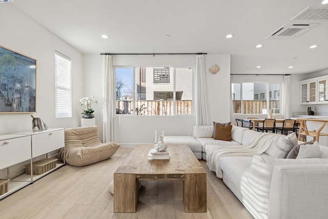 living room with light hardwood / wood-style floors