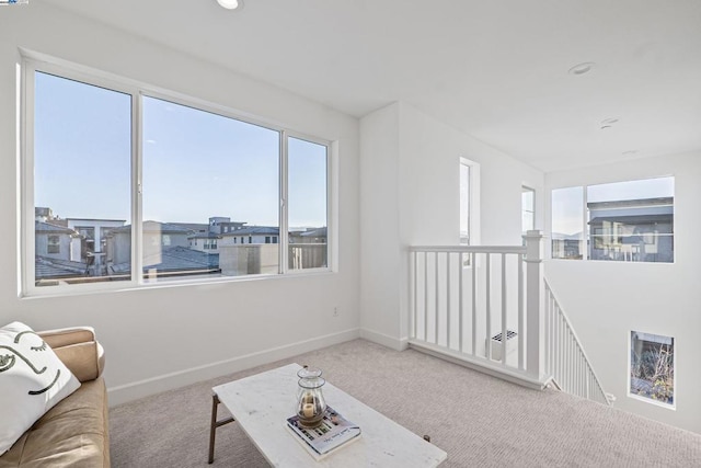 living room featuring carpet floors and plenty of natural light