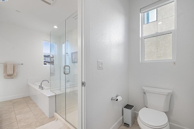 bathroom with tile patterned floors, toilet, and independent shower and bath