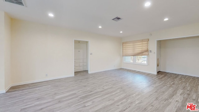 empty room with light wood-type flooring